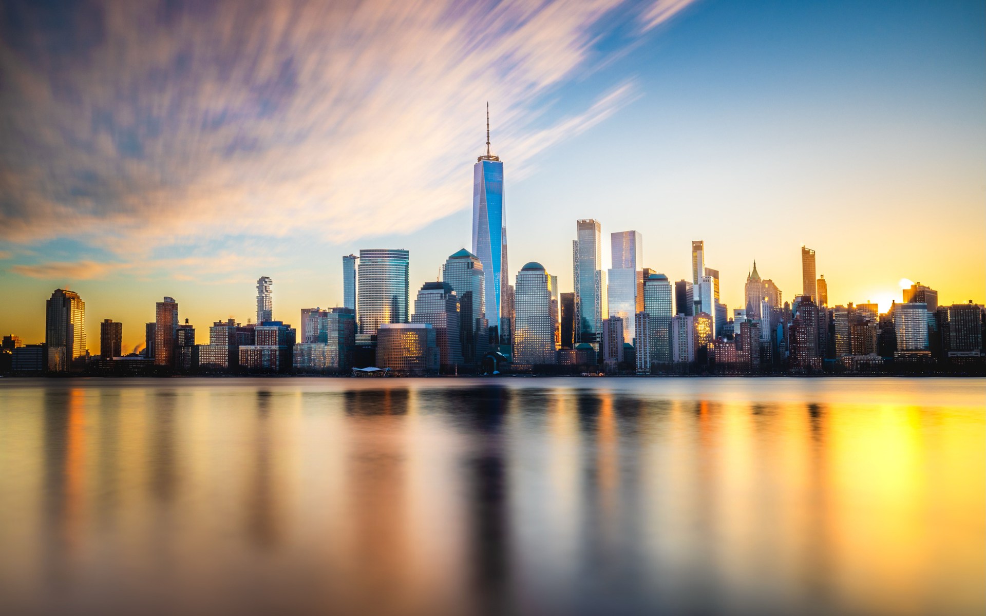 One World Trade Center at sunset from across the harbor