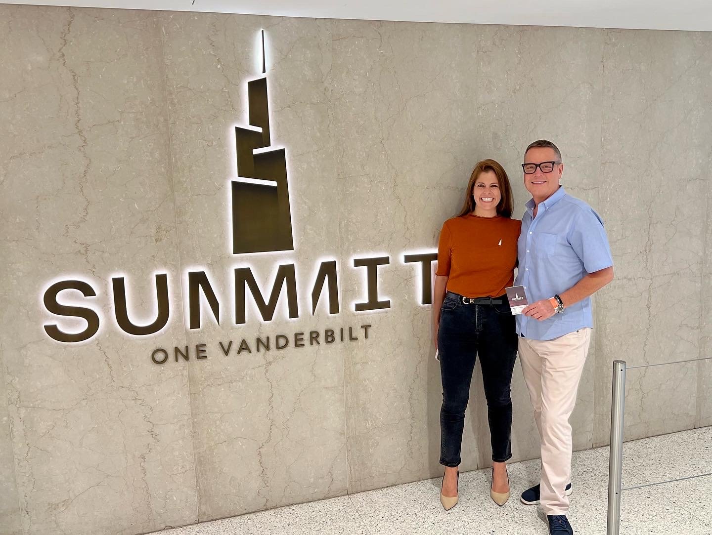 Visitors at the Summit One Vanderbilt sign